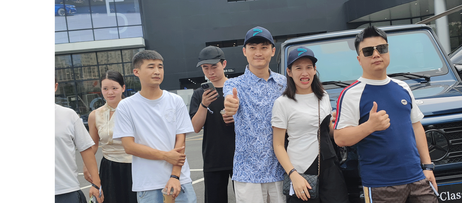 A man wearing a golf polo shirt takes a photo with his friends before setting off to play golf