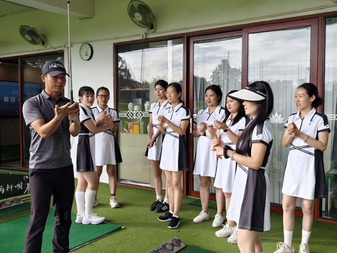 Golf coaches instructing the female students of Rise Sportswear on how to hold the golf grip