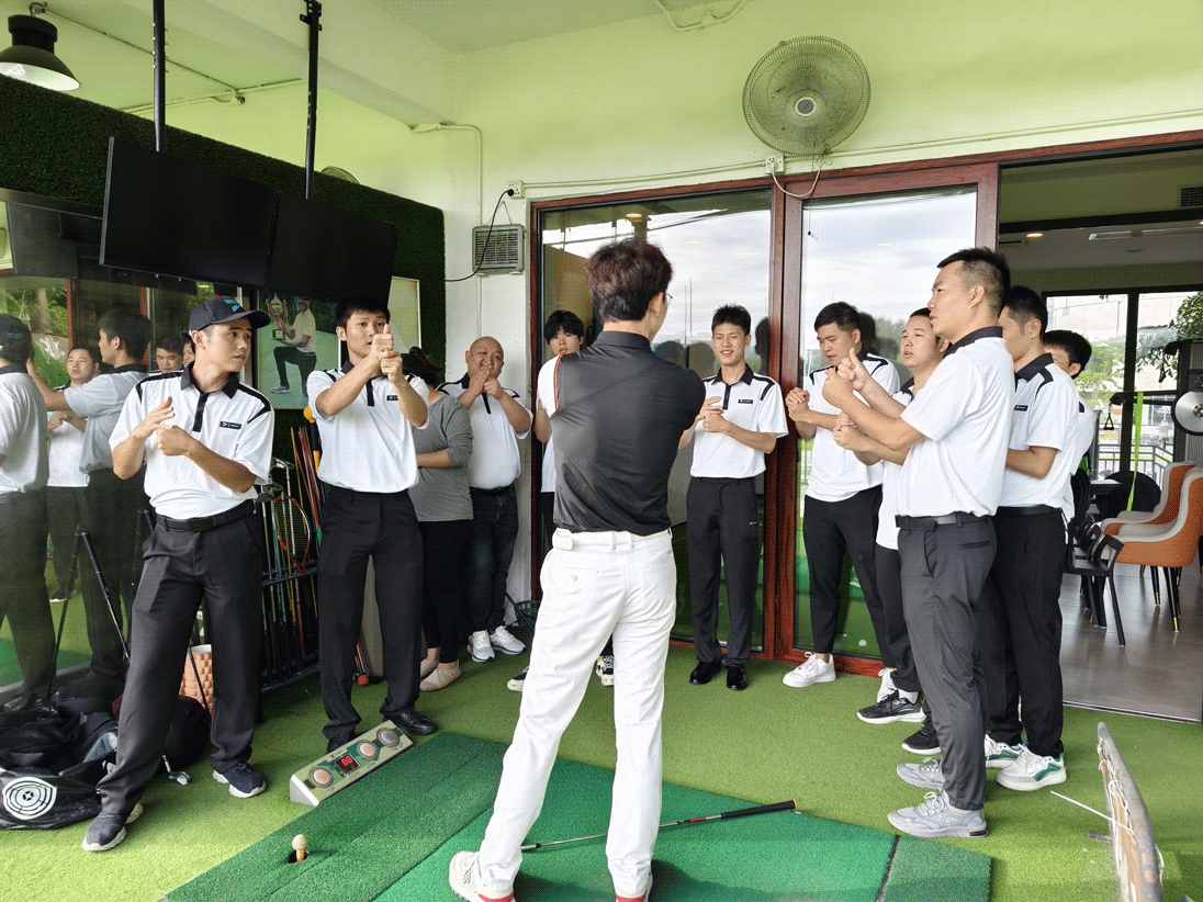 Rise Sportswear male students carefully learn the golf grip