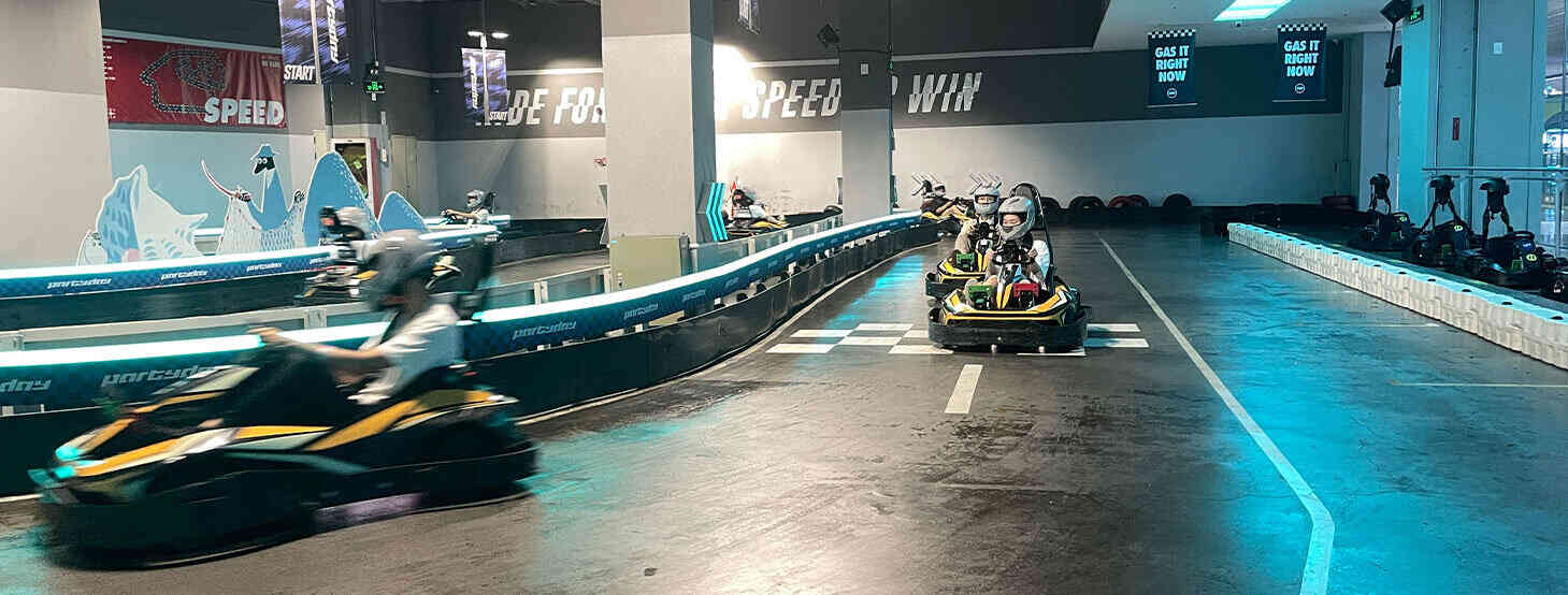 Rise team members take a quick go-kart turn.