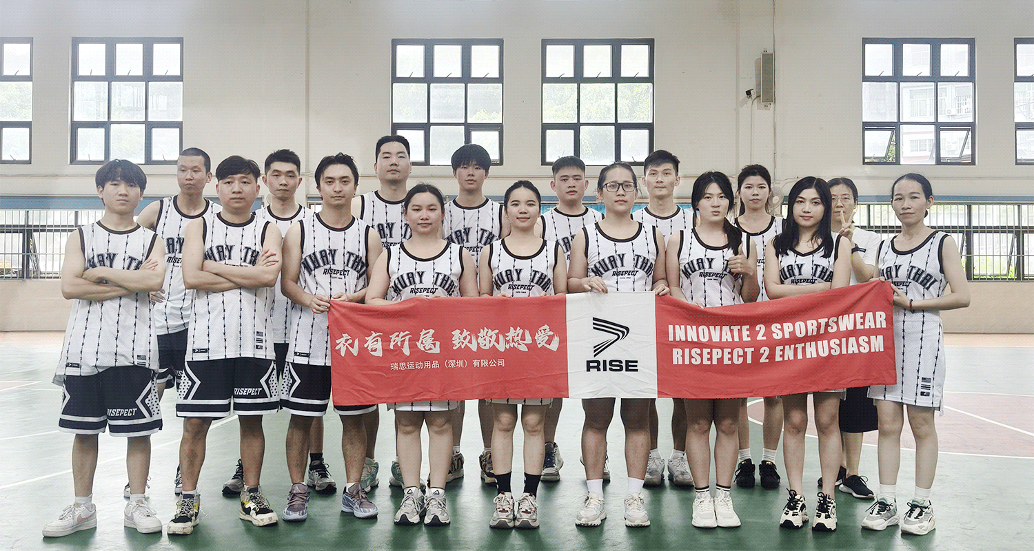 Group photo of all participants gathered together, smiling and celebrating at the end of the RISE basketball event.