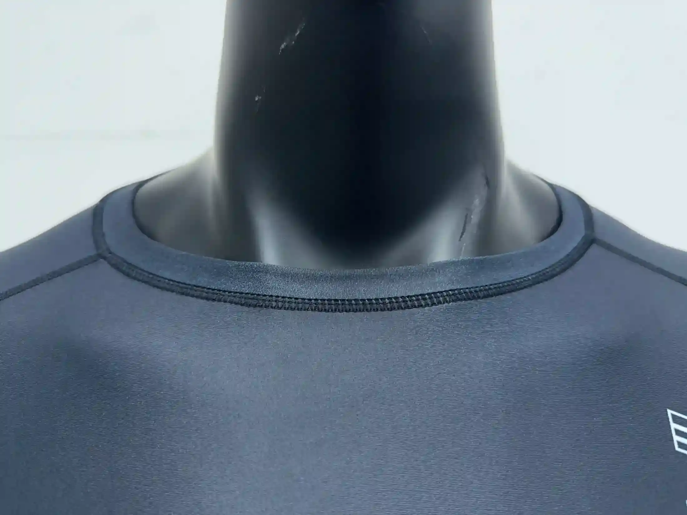 Detail of double overlock seams at the neckline