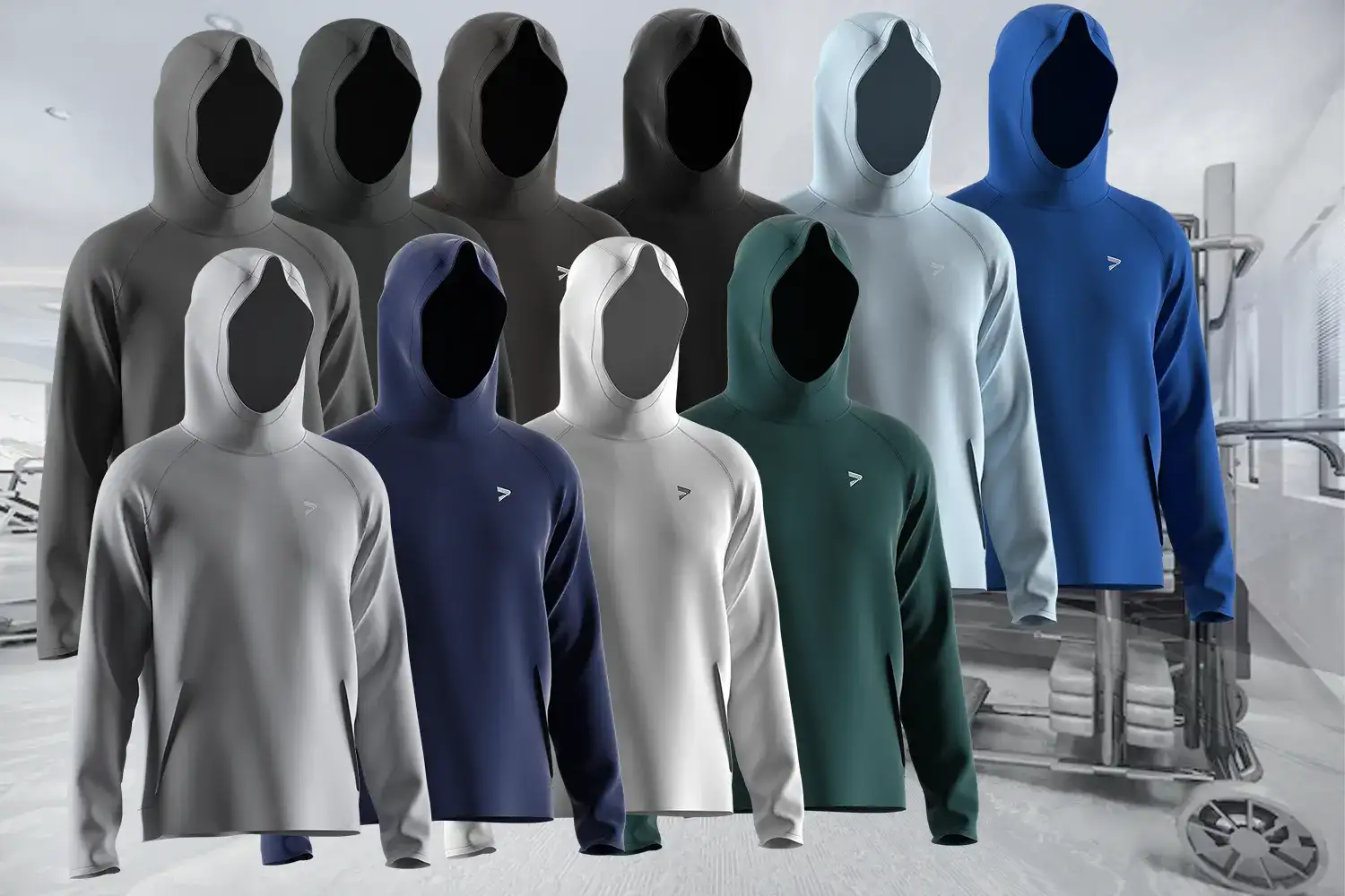 A lineup of ten solid-color athletic hoodies arranged in two rows against a gym background. Each hoodie is displayed on a faceless mannequin, showcasing its minimalist design, muscle-fit silhouette, and small chest logo. Colors include shades of grey, black, white, blue, green, and teal—highlighting the full range of the collection.