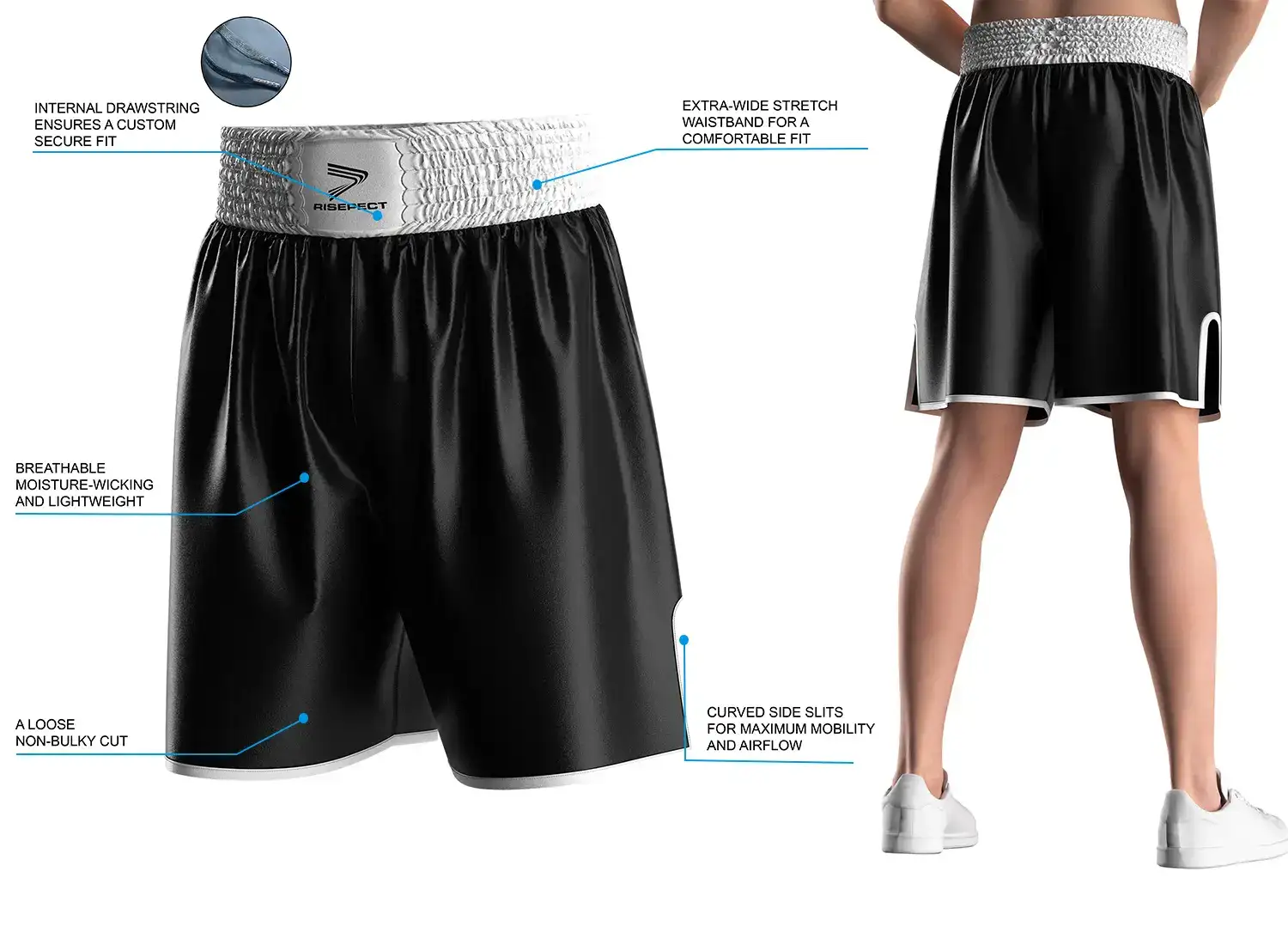 Male model wearing custom pro black white satin boxing shorts, back view, showing wide elastic waistband and side slits. The right side displays product highlights and key selling points of the modern traditional boxing short design.