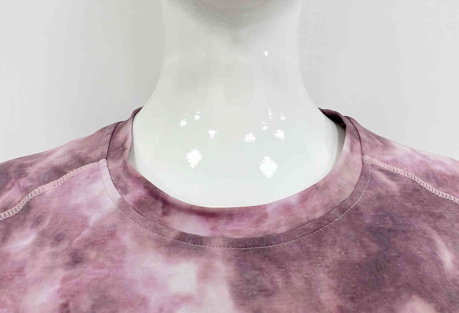 The neck details of pink women's crop short sleeve top