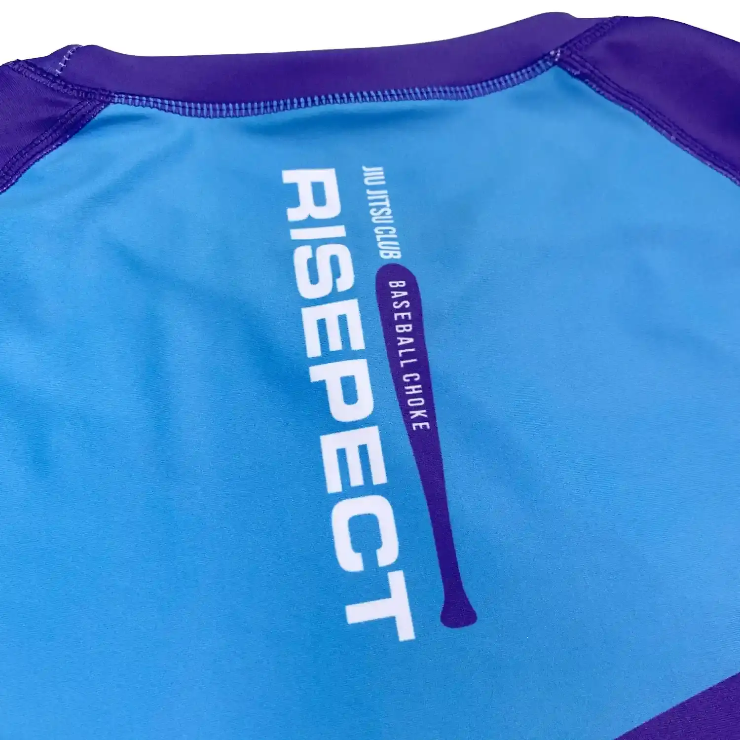Black short sleeve rash guard mma bjj three-color purple-blue flat lay back logo design details