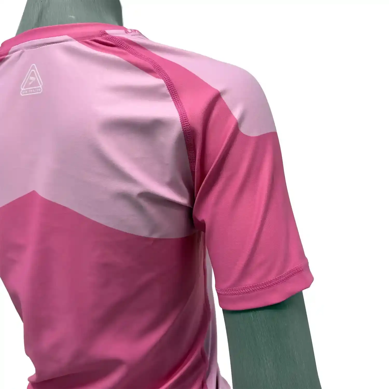 Women's feminine fit pink bjj rash guard short sleeve right back zoom flatlock seam details