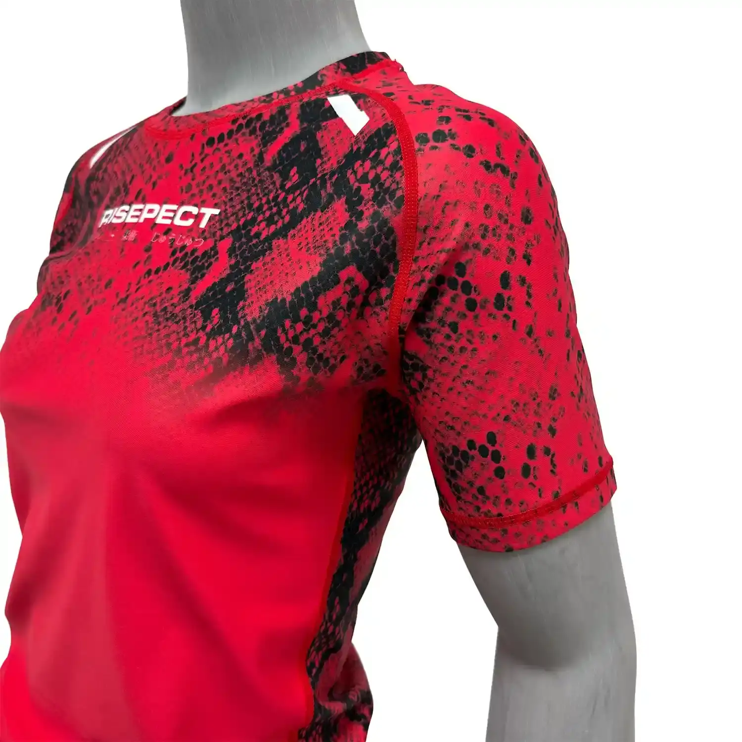 Female model in red snake pattern bjj rash guard short sleeve left front zoom flatlock seam details