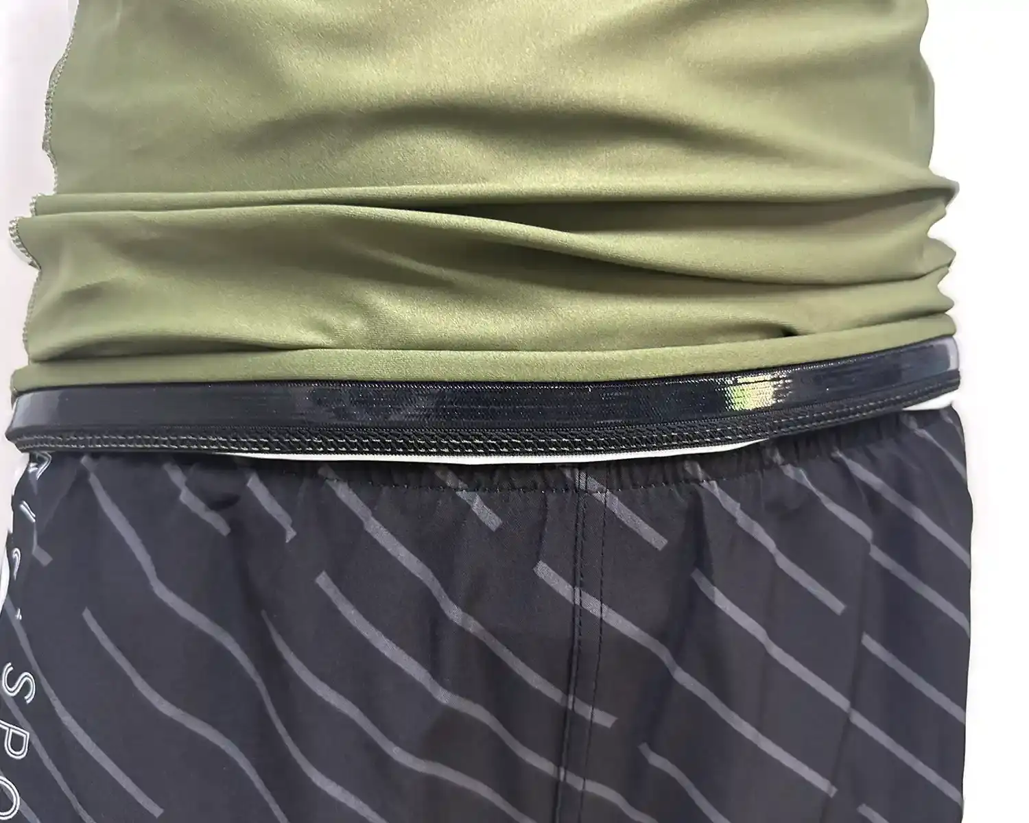 Dark green rash guard jiu-jitsu short sleeve hem inside silicone strip details