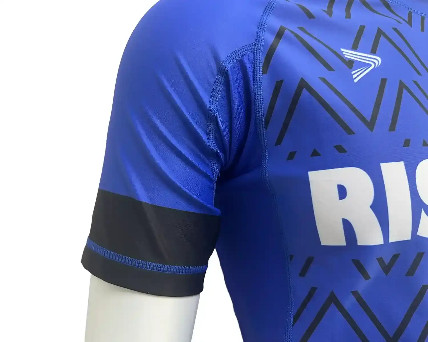 Blue rash guards with black wave front underarm mesh and flatlock seam details