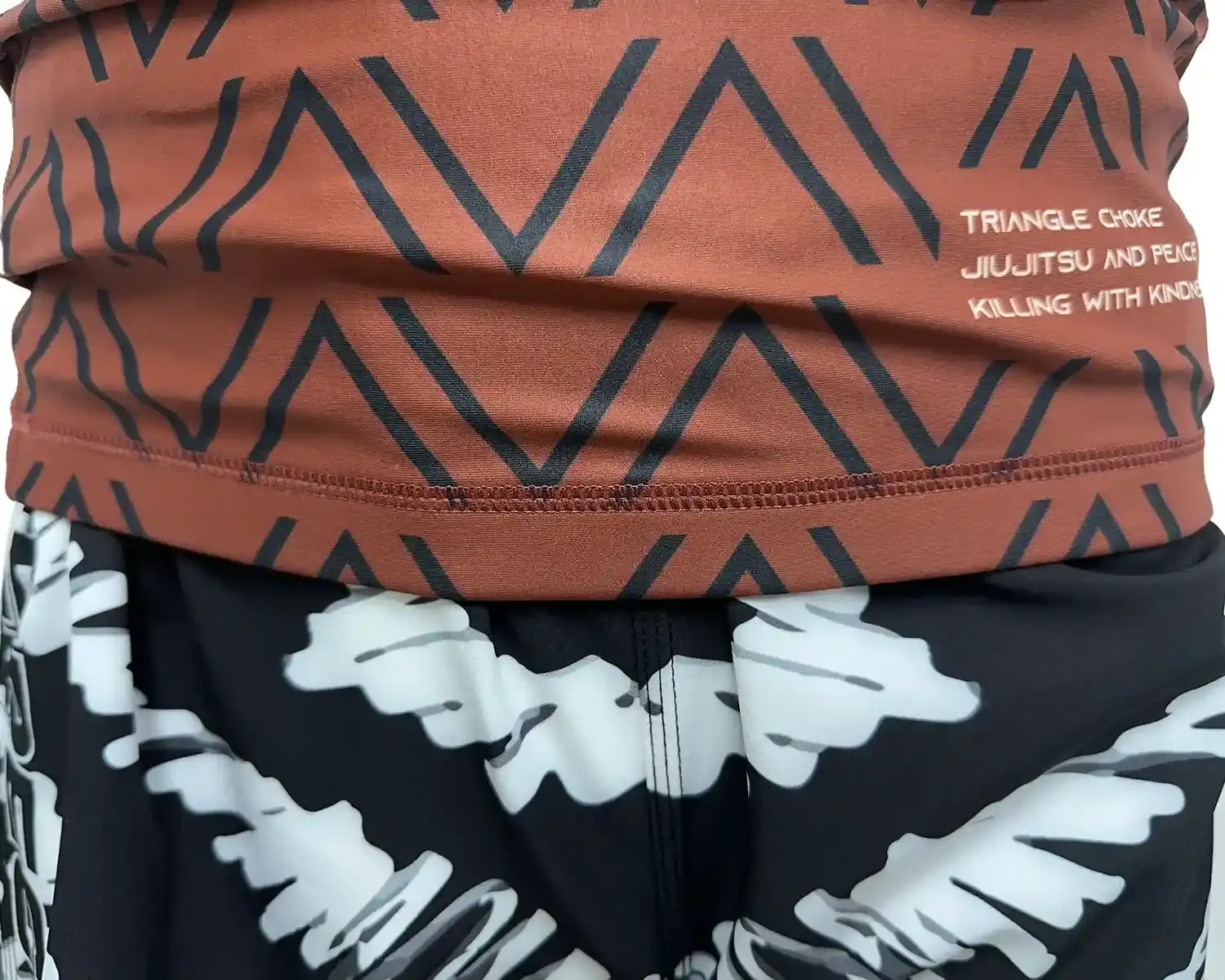 Brown rash guard black waves for men bjj hem external details