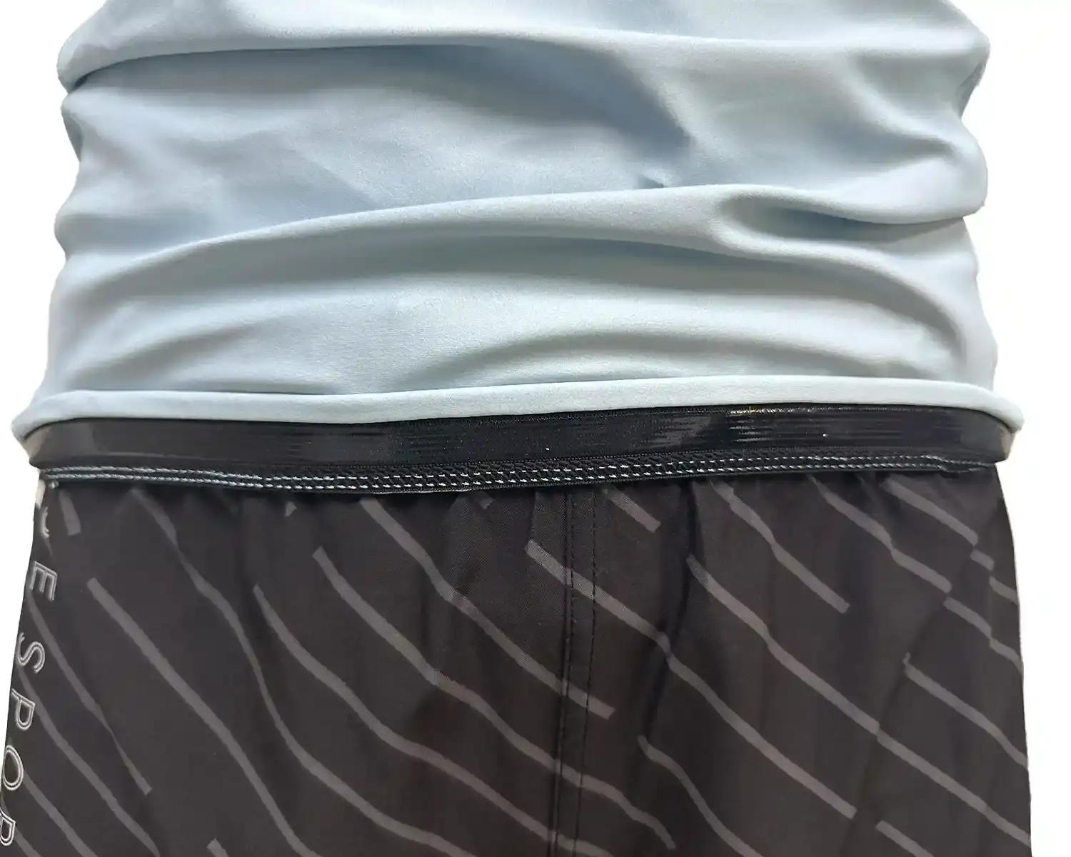 Red sleeve jiujitsu rash guard hem inside silicone strip details