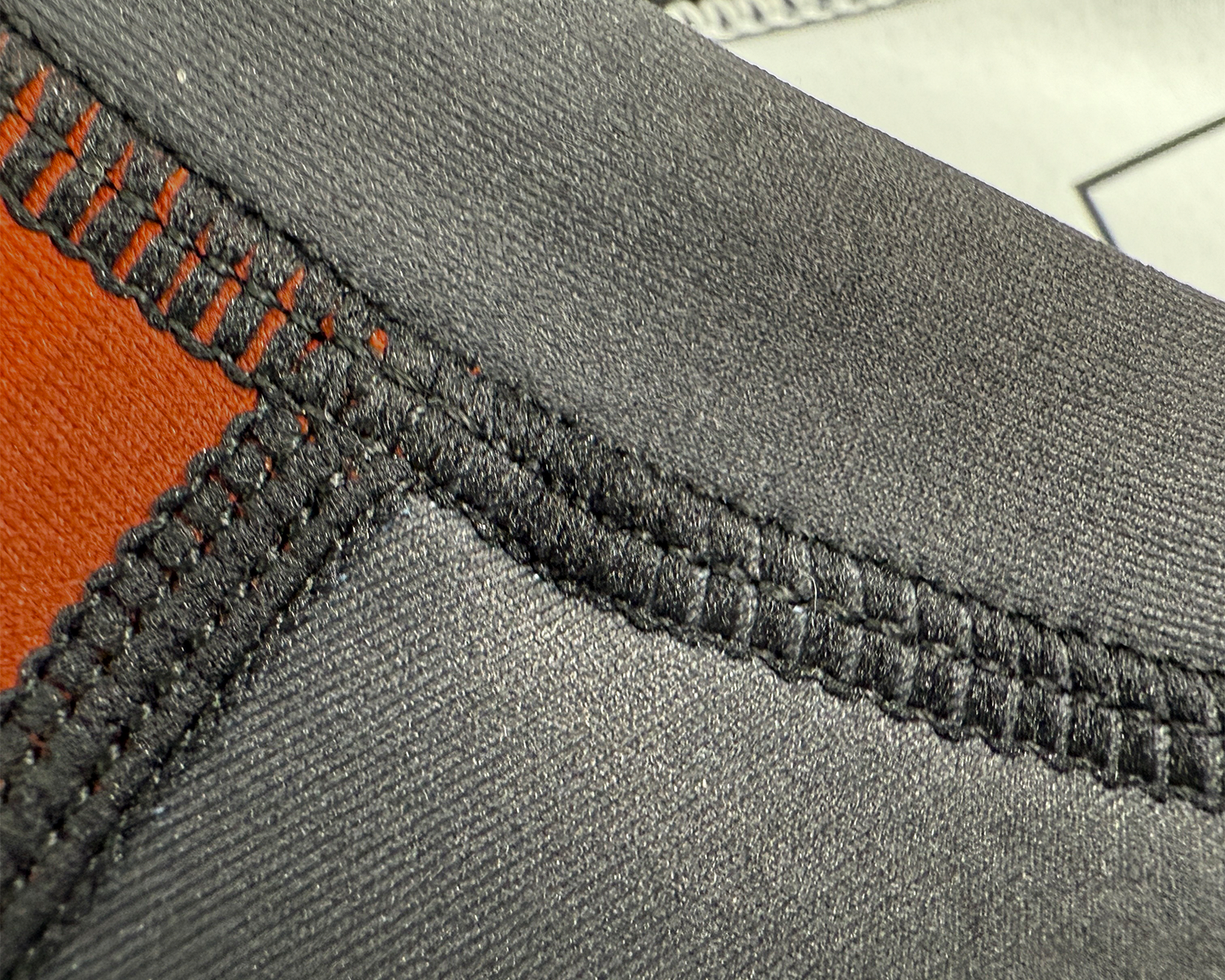 Prajna short sleeve rash guard neck overlock and flatlock seam details