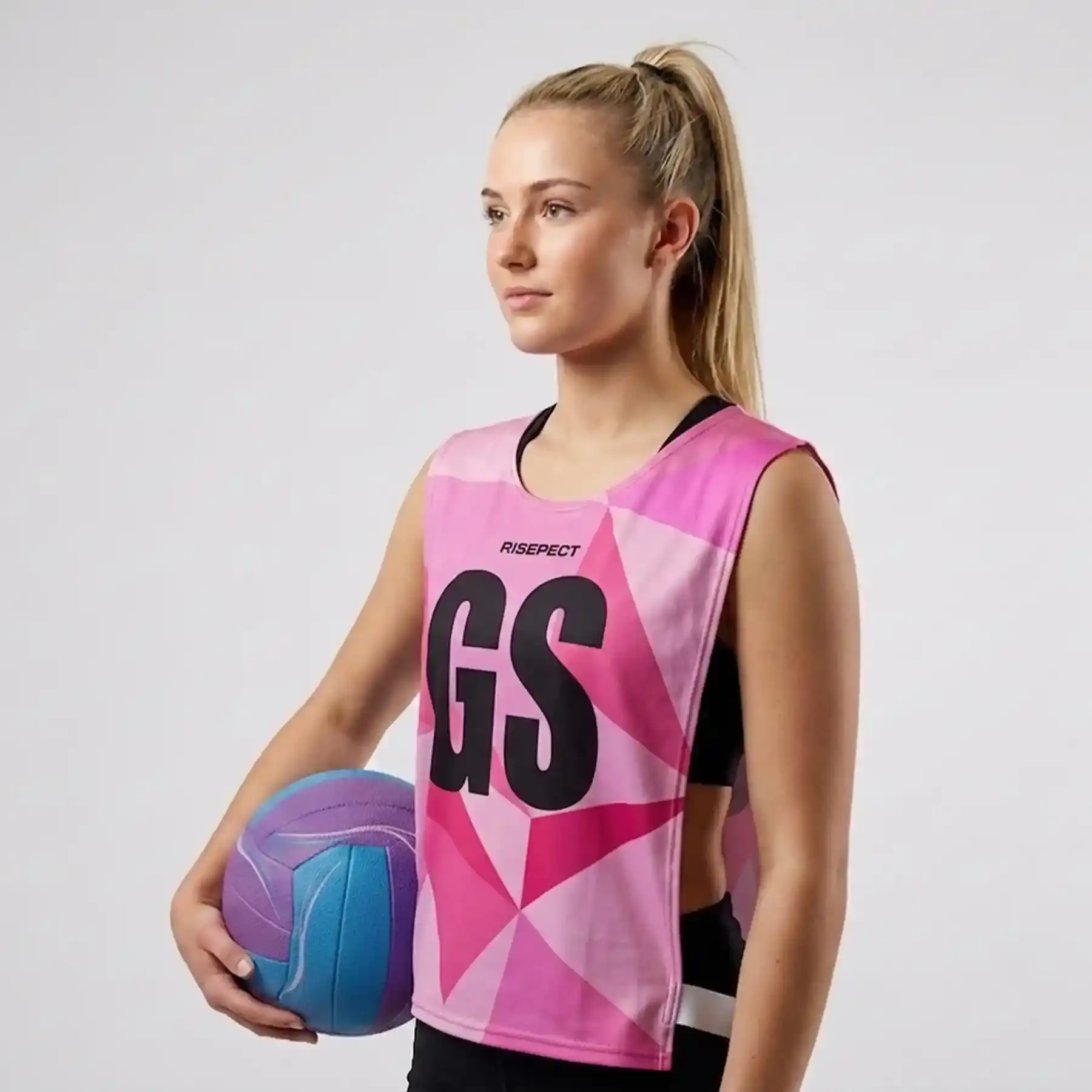 Women Model in Pink Geometric Open-Side Training Pinnies Wholesale for Rowing Team with The Letters GS