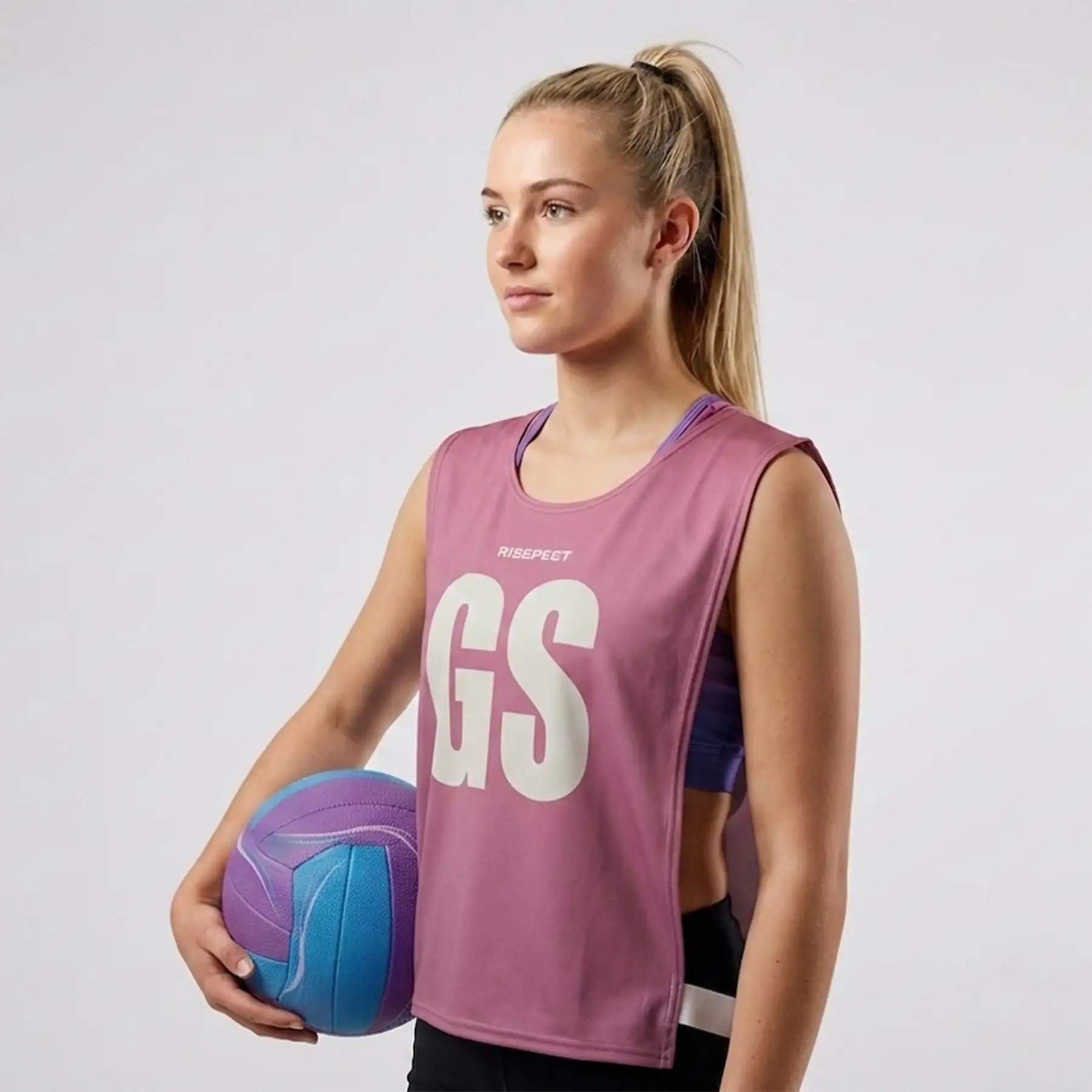 Female model in purple ventilated rowing soccer scrimmage vest canoe wear