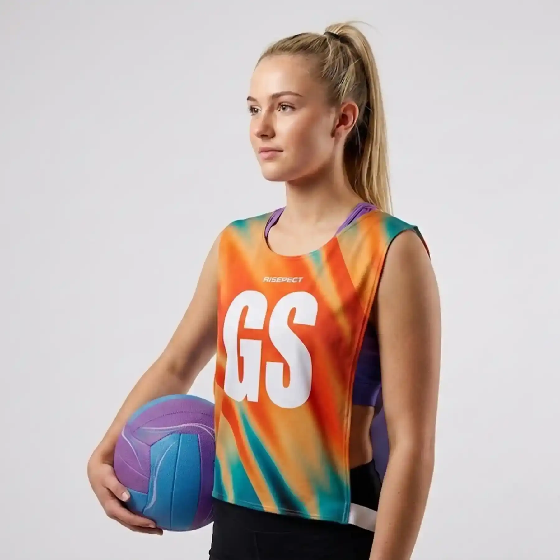 Female model in vibrant orange rowing marathon pinny open-sides with elastic straps